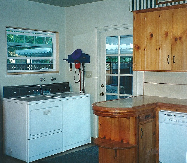 washer and dryer in corner of small kitchen before remodel