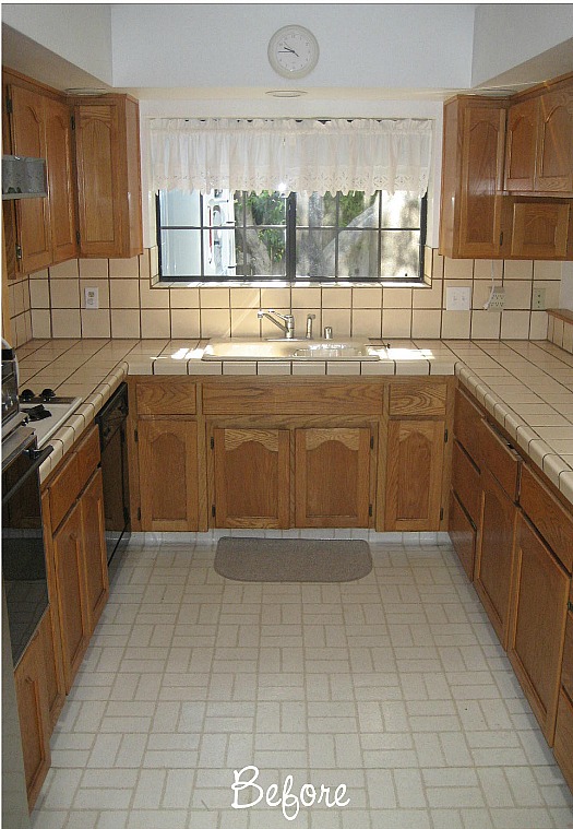 A kitchen with a tile floor before remodel