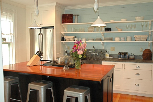 A kitchen with open shelves