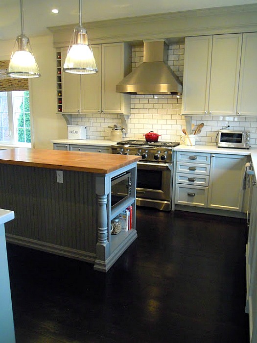 A kitchen with an island in the middle of a room