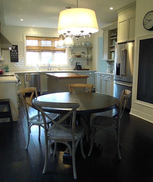 A kitchen with a dining room table