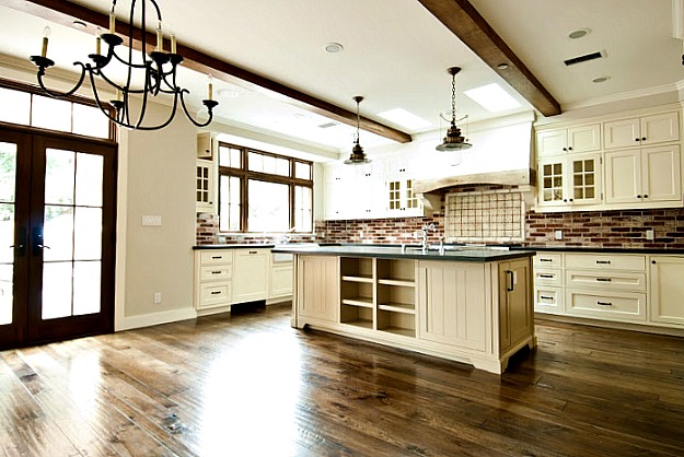 A kitchen with a wood floor