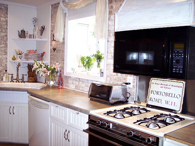 A stove top oven sitting inside of a kitchen