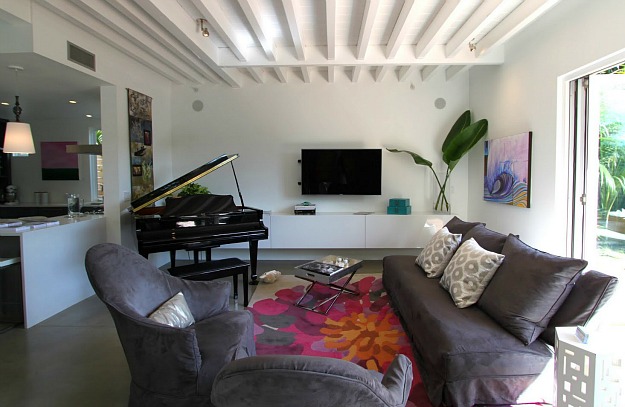 A living room filled with furniture and a flat screen tv