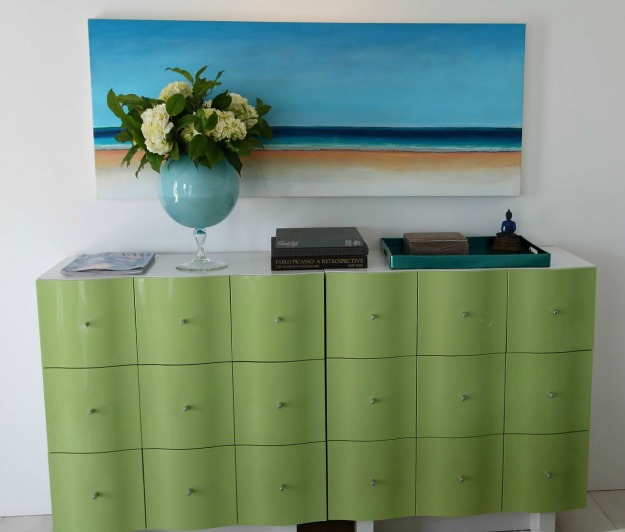 A close up of a green dresser