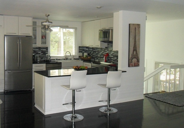 Modern kitchen with black granite countertops