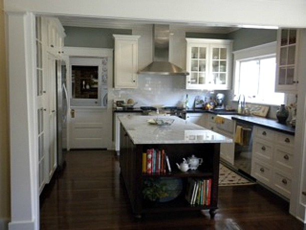 A kitchen with a wood floor