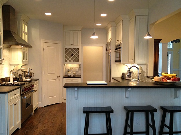 A kitchen with an island in the middle of a room