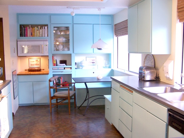 A kitchen with a wooden floor