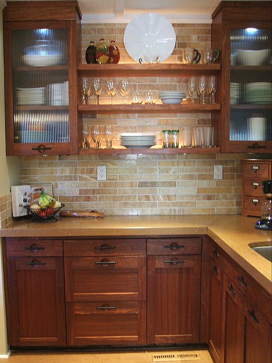 A kitchen with open shelves