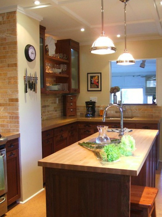 A kitchen with an island in the middle of a room