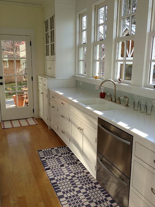 A small galley kitchen with a large window