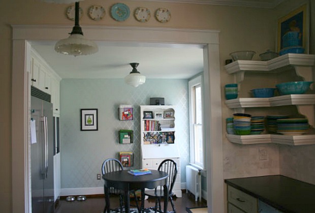 A kitchen with a dining room table