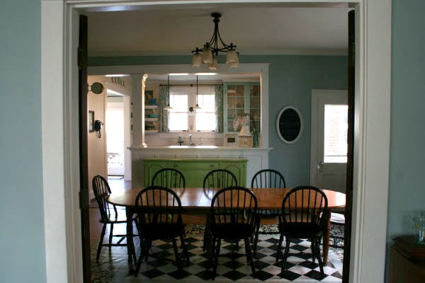 A dining room table in front of a window