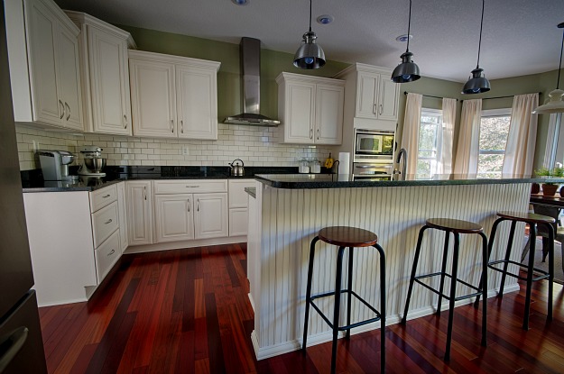 A kitchen with a wooden floor