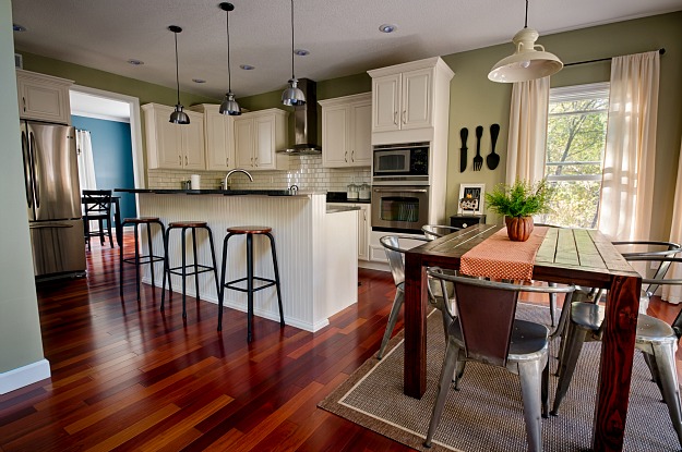 A kitchen with a dining room table