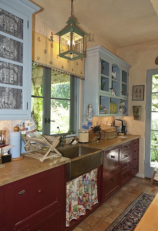 A kitchen with a sink and a window