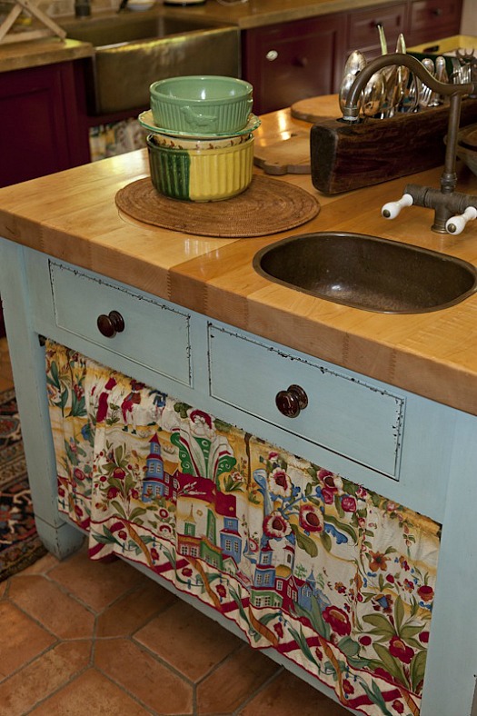 A kitchen with a stove and a sink