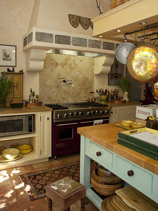 A stove top oven sitting inside of a kitchen