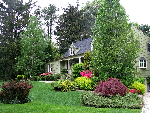 front exterior of cute cape cod in spring