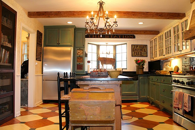 A kitchen with an island in the middle of a room