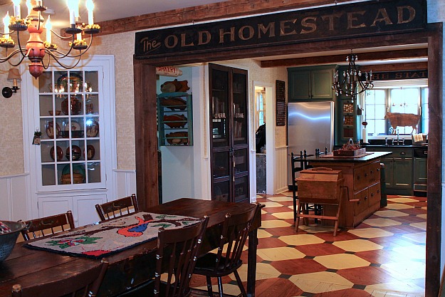 sign over kitchen door that says The Old Homestead