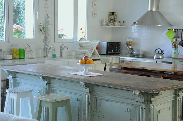 A kitchen with a sink and a window