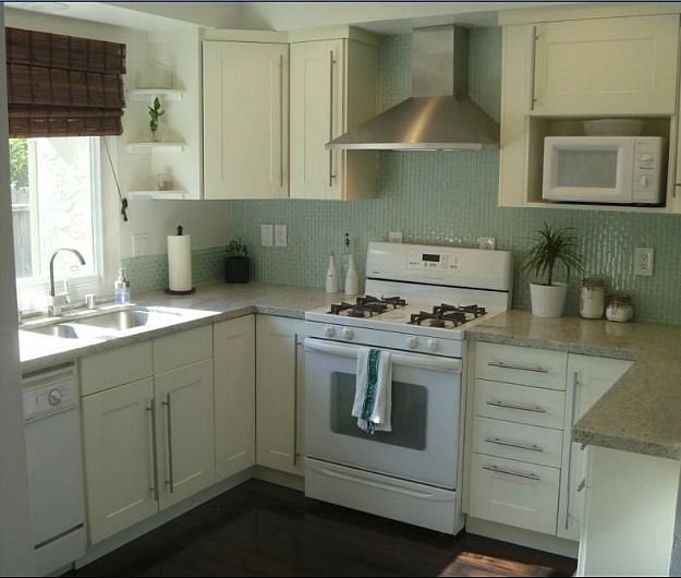 A kitchen with a sink and a microwave