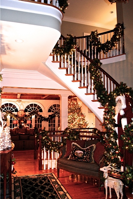 staircase decorated with garland for Christmas