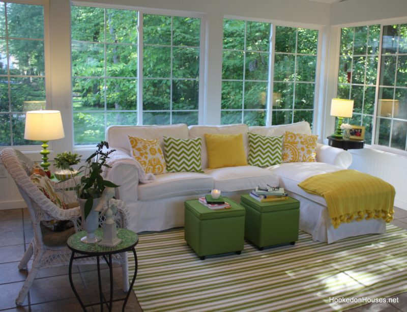 My sunroom decorated with green and yellow and Ektorp sofa