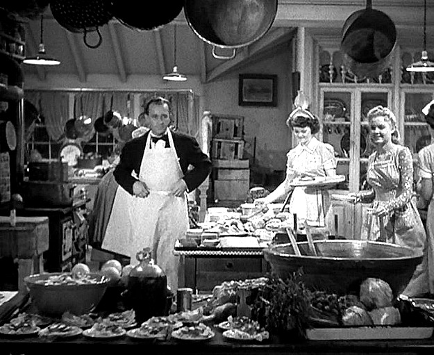 Bing Crosby and workers in kitchen