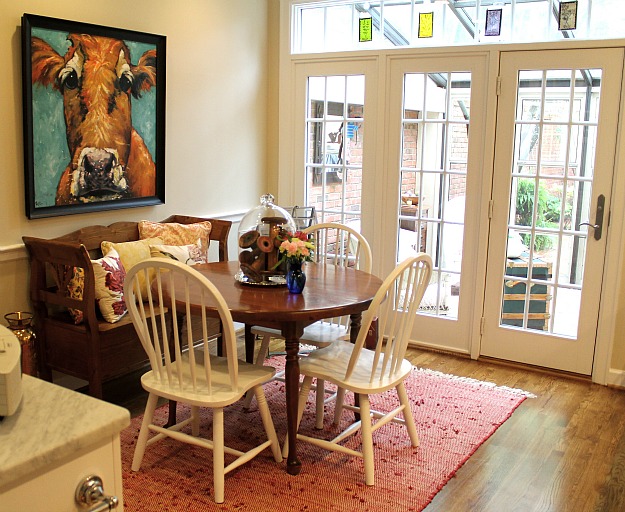 A dining room table in front of a window