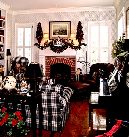 A living room decorated for Christmas with fireplace