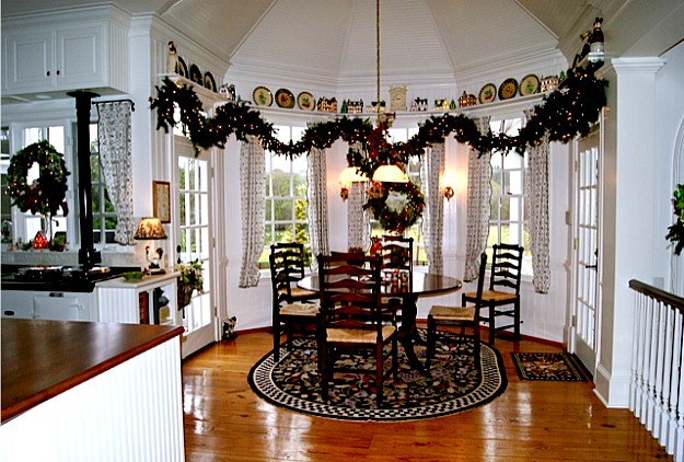 eating area of kitchen with garland over windows