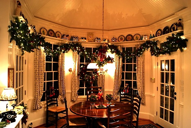 round kitchen and chairs in eating area at night