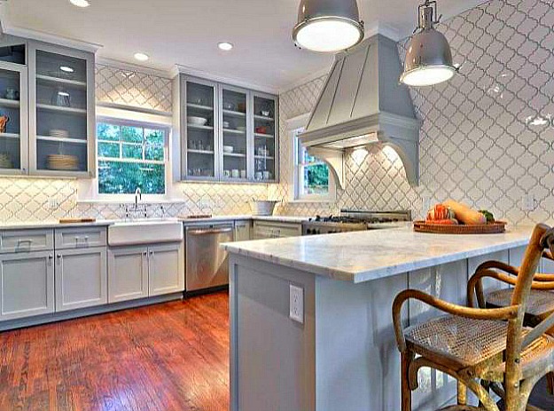 kitchen with pale gray blue cabinets and vent hood after remodel