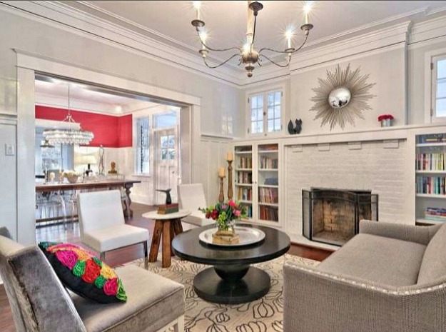 A living room filled with furniture and a fire place