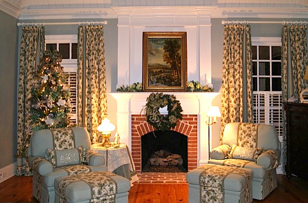 A living room filled with furniture and a fire place