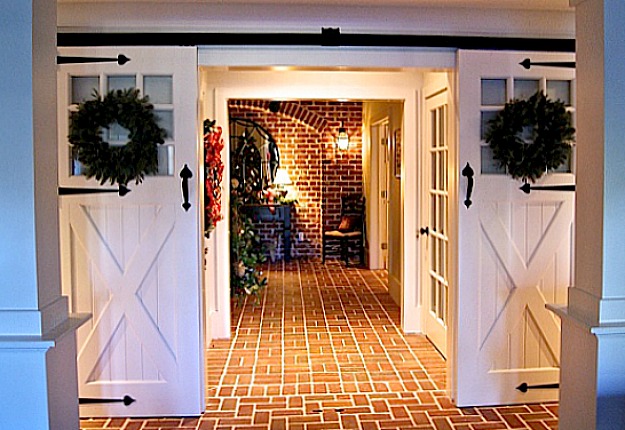 barn doors and brick floor in lower level