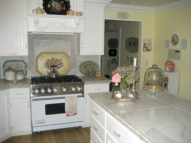 A stove top oven sitting inside of a kitchen