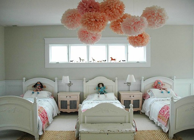 girls bedroom with pink pom poms