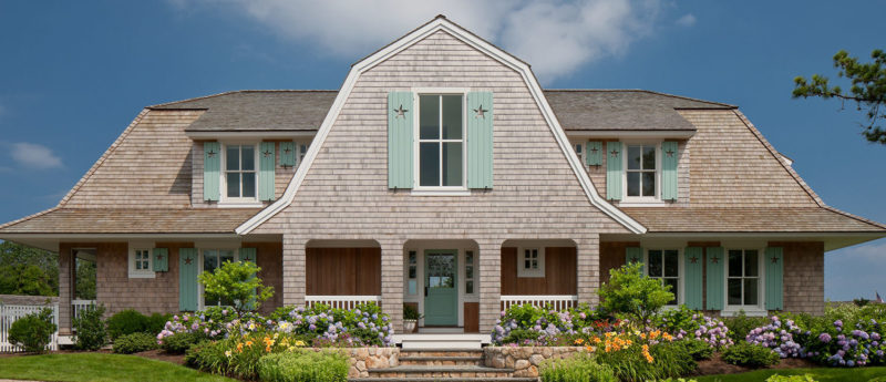 Little Beach Shingle style house exterior with aqua door and shutters