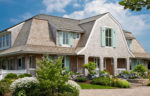 A Shingle-Style House on Cape Cod with Aqua Shutters