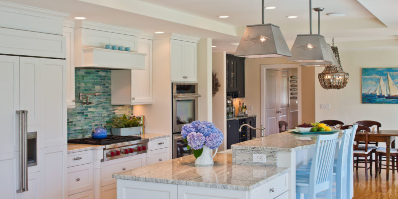 A kitchen with an island in the middle of a room