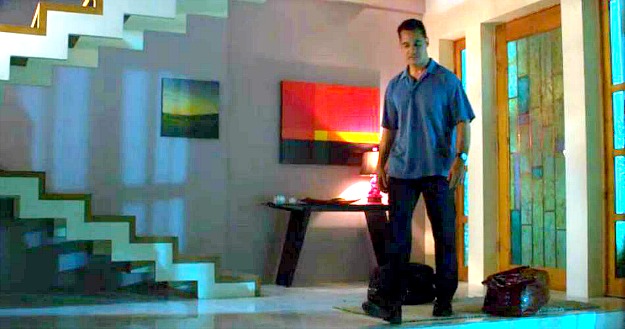 A man standing in a room of Rebecca\'s house