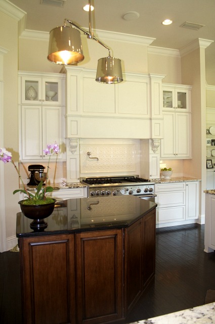 A kitchen with a stove and a sink