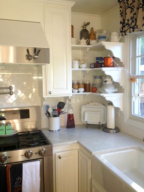 A kitchen with a stove and a sink