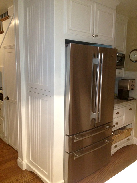 A stainless steel refrigerator in a kitchen