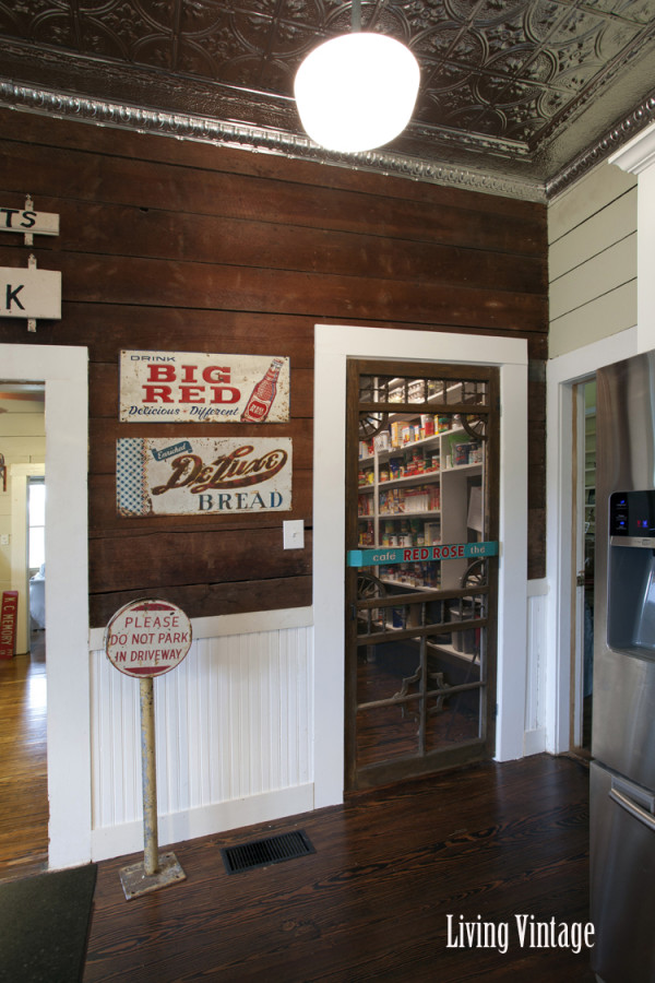 vintage signs on kitchen wall