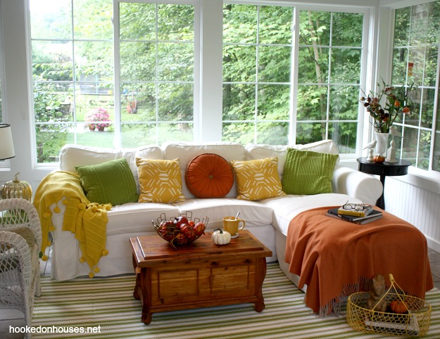 Sunroom decorated for fall